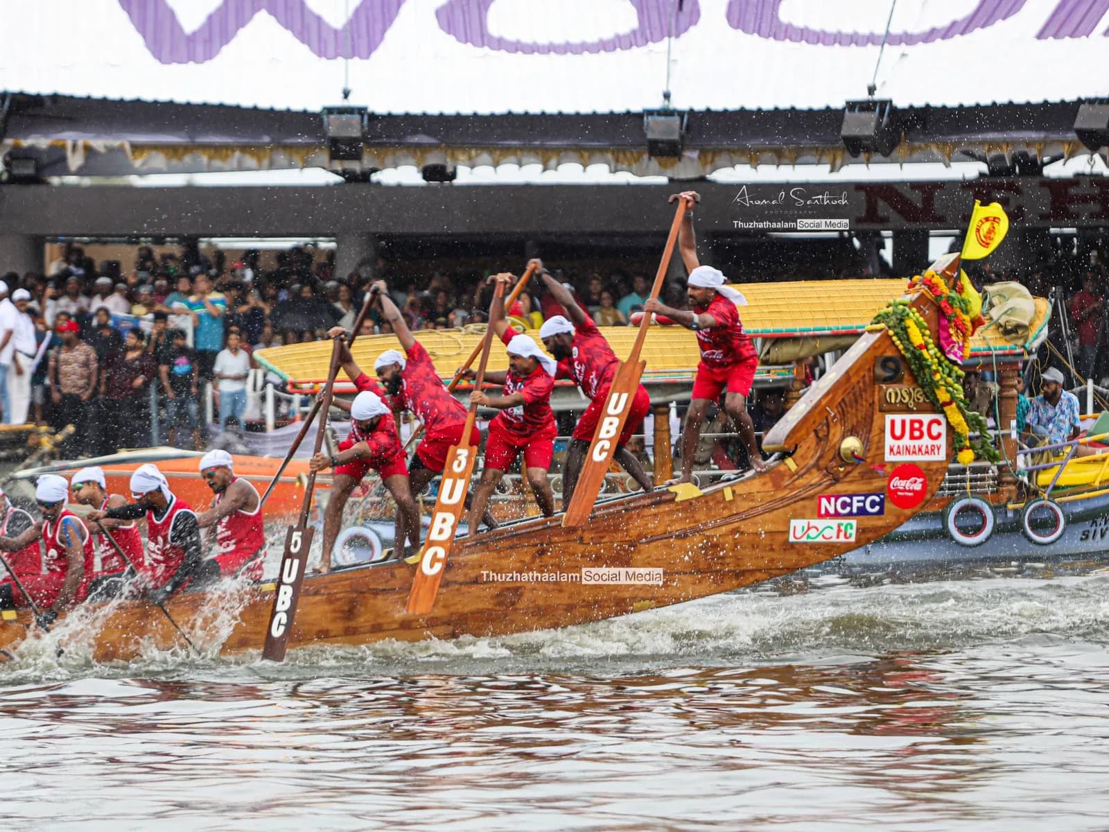 UBC Kainakary steersmen powering their boat past the Nehru Trophy pavilion